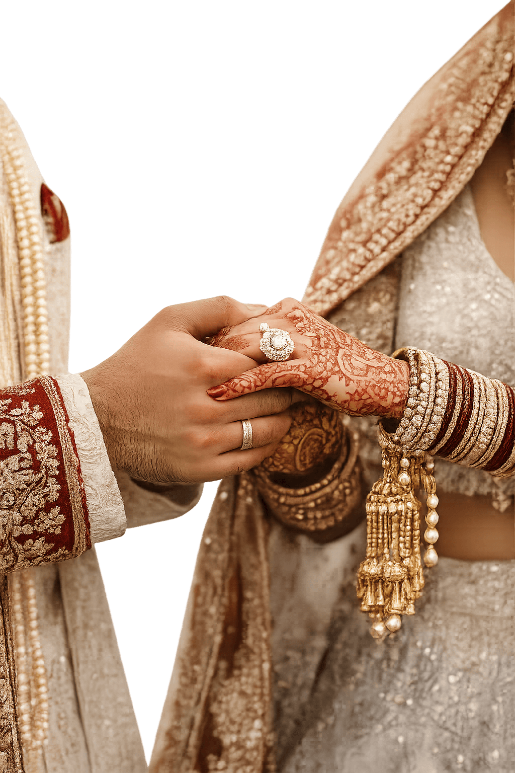 Couple holding hands during a traditional Indian ceremony